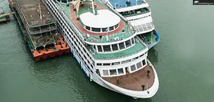 Yangtze River cruise ship docked with a mini golf course on deck, Chongqing, China.