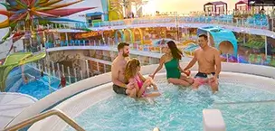 Caribbean Icon of the Seas Two couples relaxing in a Hot Tub