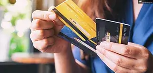 Cruise_Tips_And_Tricks An image of a woman choosing a credit card