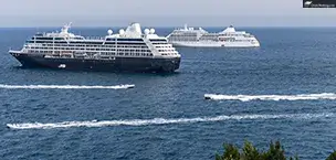 A sunny day at sea with two cruise ships