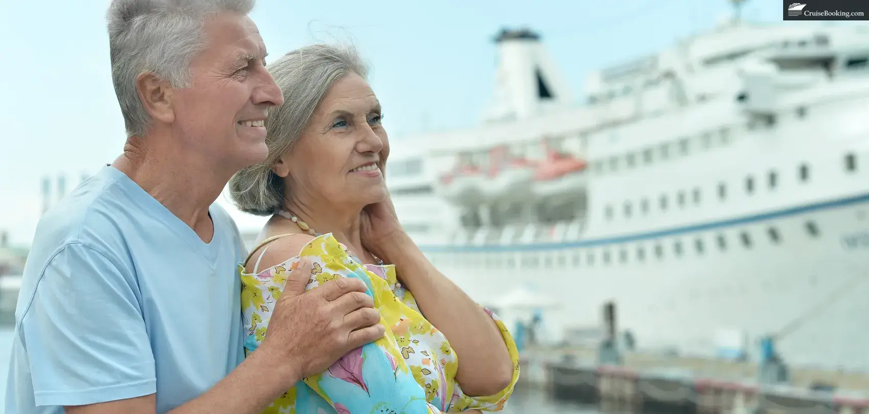 Standing on a pier is a senior couple