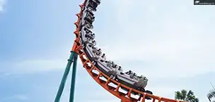 On a cruise, passengers enjoy a roller coaster