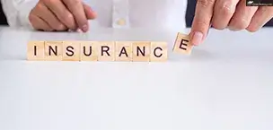 Insurance concept hand wooden arrangement on wood