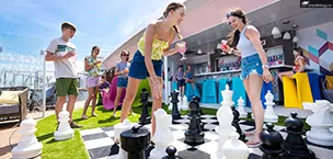 First_Time_Cruisers On Wonder of the Seas teens friends playing chess