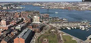 Aerial view of Boston harbor with city skyline