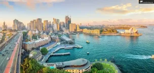 Oceania_Cruise_Tips Sydney skyline and harbor view at sunset, featuring the iconic Sydney Opera House and cityscape