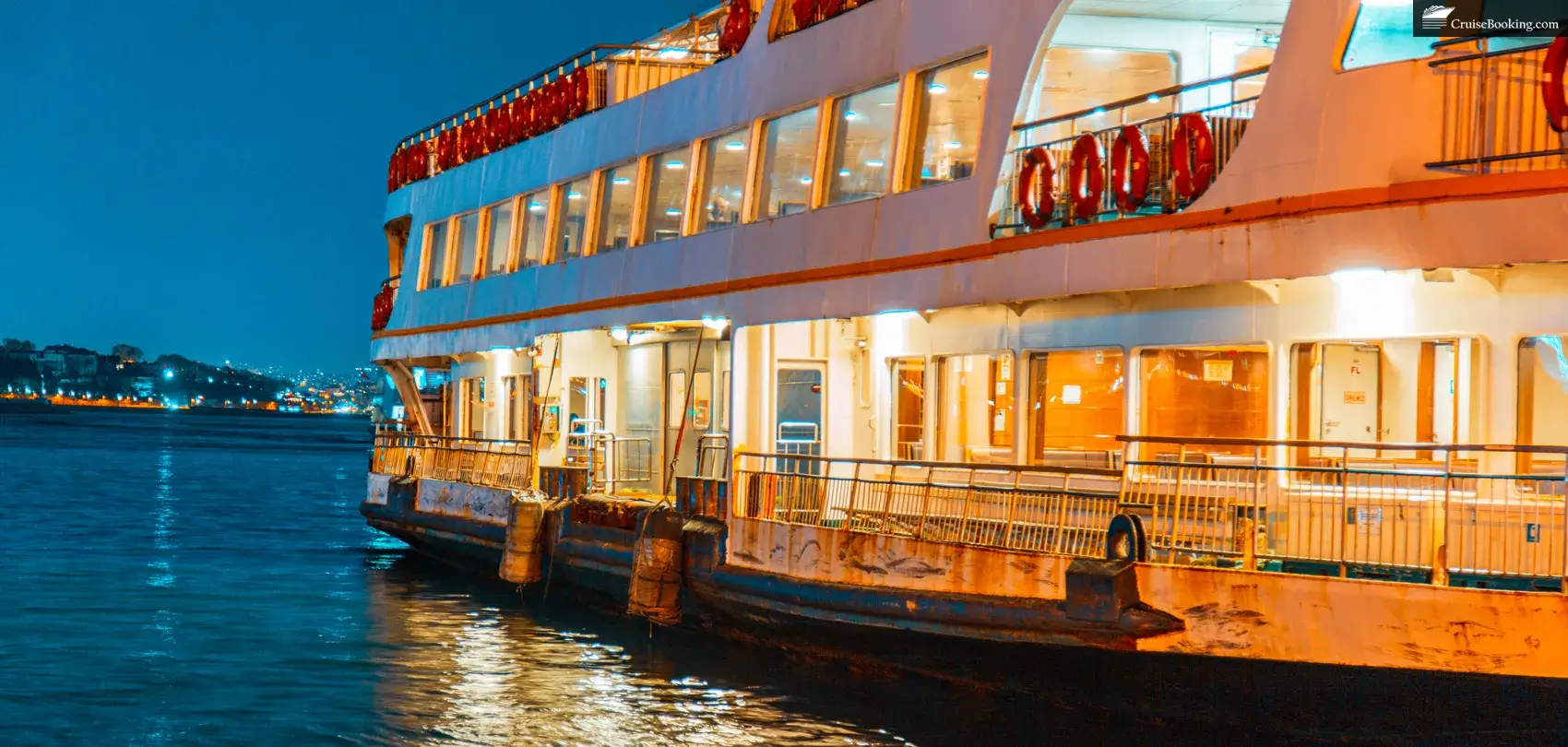 At twilight, a river cruise ship ferry can be seen