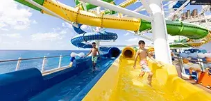 kids and teens, young boy coming out of slide