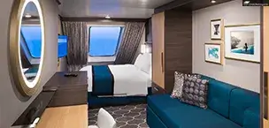 Cozy solo cruise cabin on Harmony of the Seas, featuring a large ocean-view window and modern decor