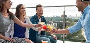A group of friends toasting each other at a party