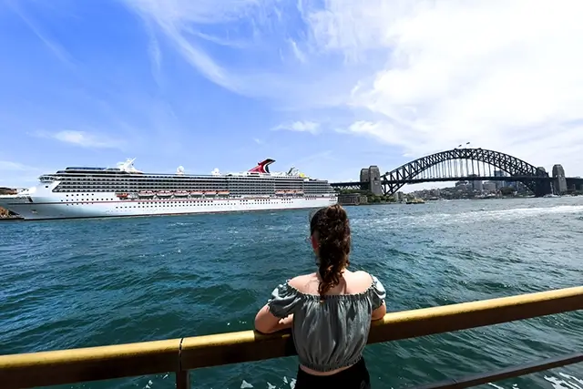 A cruise ship, the Carnival Legend, docks at Circular Quay, Sydney Harbour's Overseas Passenger Terminal