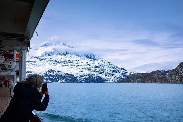 A cruise ship sails through Glacier Bay National Park in Alaska