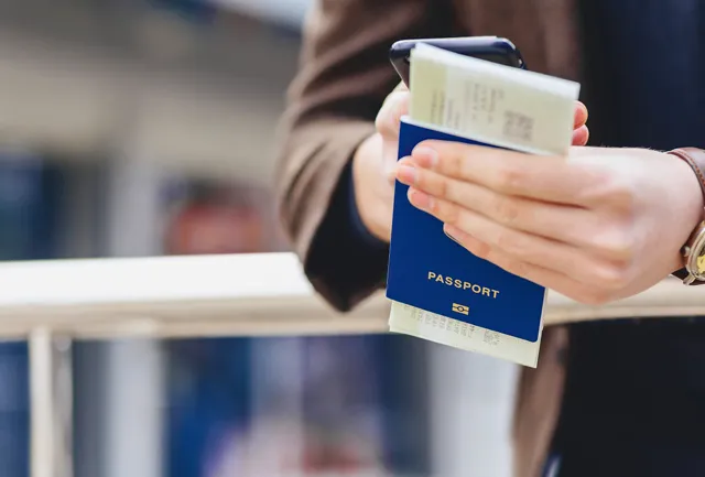 women holding passport in Hand