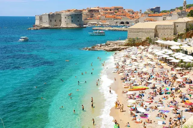 Old town of Dubrovnik and Banje beach, Adriatic Sea, viewed from the sky