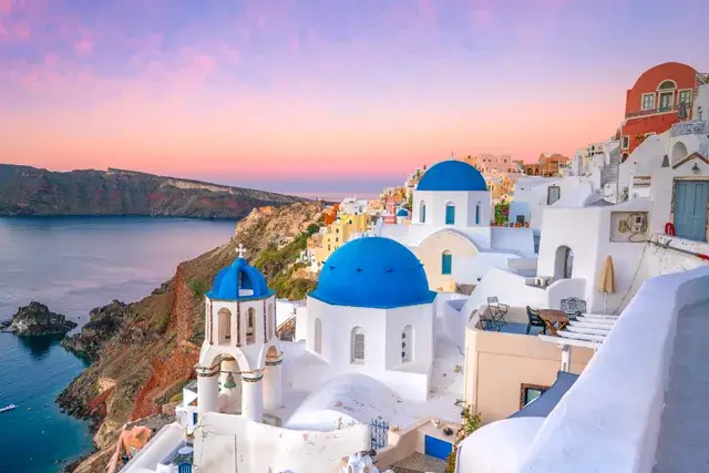 The sunset on Santorini island is spectacular at twilight. A sunset in the famous Greek city of Oia, Europe