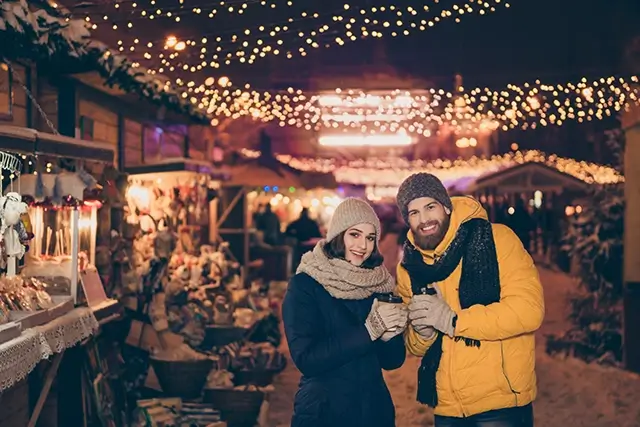 An image of a young couple enjoying the holiday season in the city