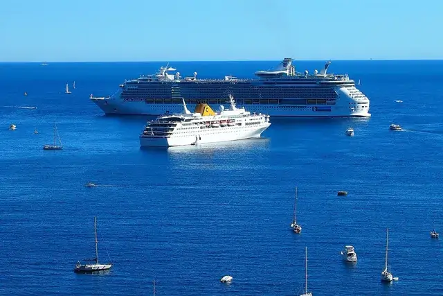 Image of a cruise ship, Mediterranean sea, and a yacht