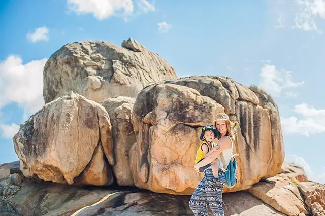 Mother and son travelers at Ayo Rock Formations, a popular tourist destination