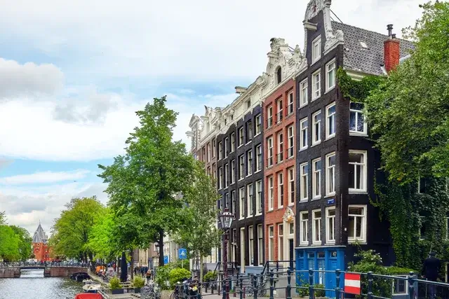 A beautiful view of Amsterdam's streets, ancient buildings, and embankments