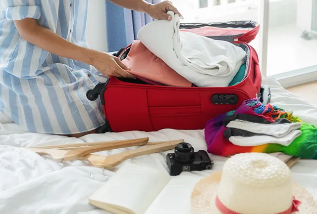 Women Packing clothes in Bag