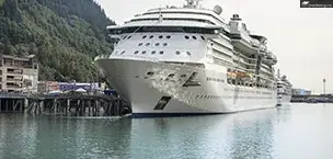 Alaskan pier with a big cruise ship
