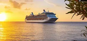 big cruise liner in caribbean sea at sunset